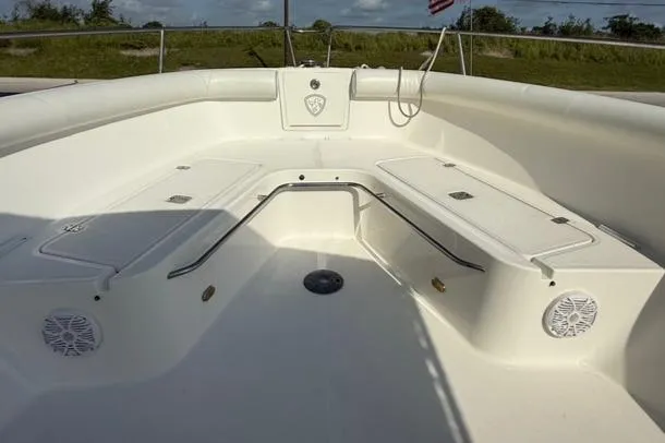 Slide: The Image of 2006 Century 3200 Center Console boat interior with seating and storage compartments. - 11