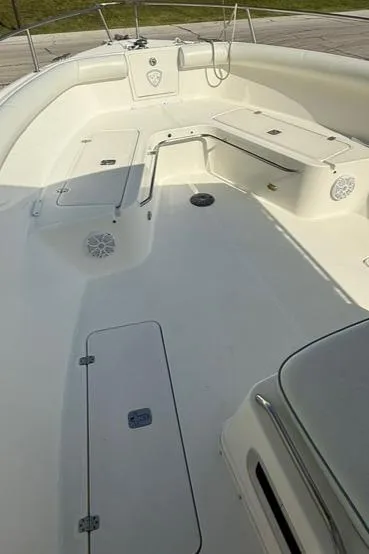 Slide: The Image of 2006 Century 3200 Center Console boat interior with seating and storage compartments. - 12