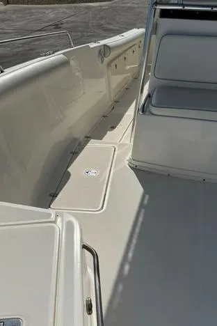 Slide: The Image of 2006 Century 3200 Center Console boat interior with seating and storage compartments. - 13