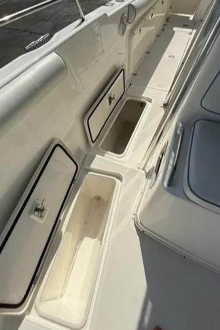Slide: The Image of 2006 Century 3200 Center Console boat with open storage compartments. - 18