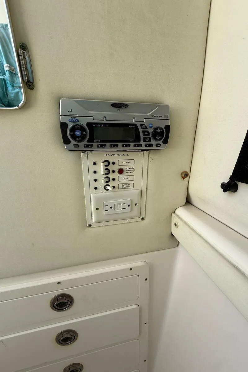 Slide: The Image of Control panel and stereo system on a 2006 Century 3200 Center Console boat. - 22