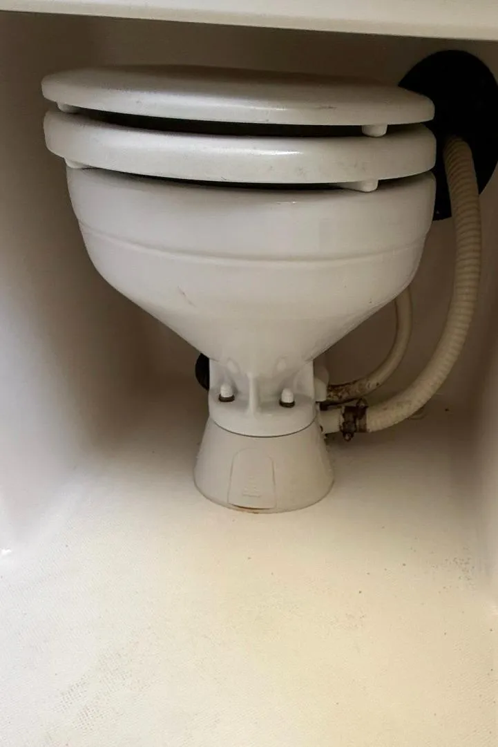 Slide: The Image of Boat toilet in a 2006 Century 3200 Center Console. - 23