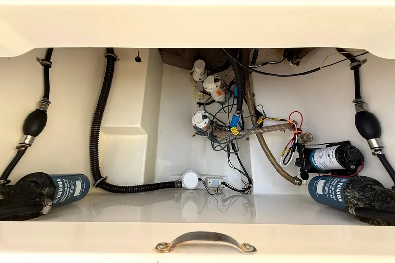 Slide: The Image of 2006 Century 3200 Center Console boat wiring and components in storage compartment. - 26