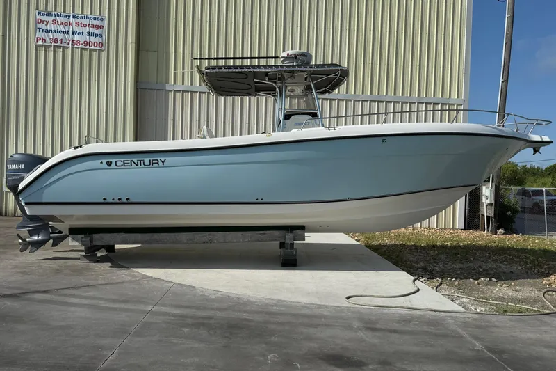 Slide: The Image of 2006 Century 3200 Center Console boat on display outside a storage facility. - 3