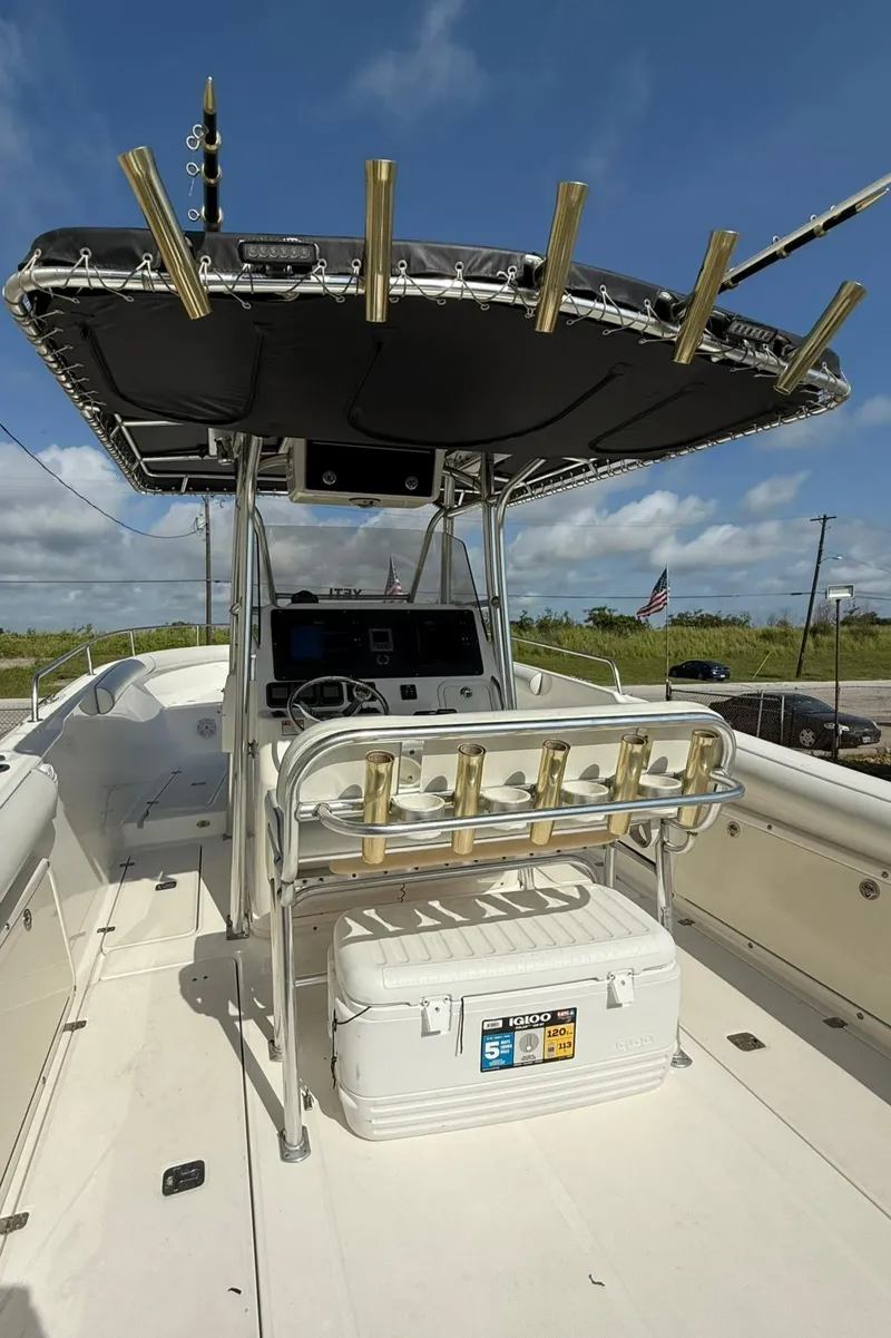 Slide: The Image of 2006 Century 3200 Center Console boat with T-top and rod holders. - 5