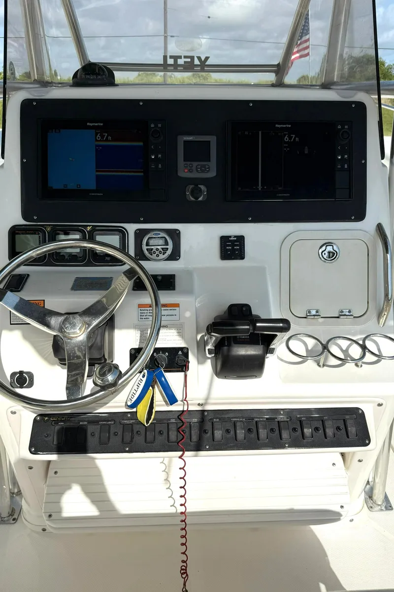 Slide: The Image of Century 3200 Center Console 2006 dashboard with steering wheel and navigation controls. - 6