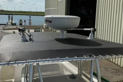 Slide: The Image of 2006 Century 3200 Center Console boat with radar equipment on the roof. - 9
