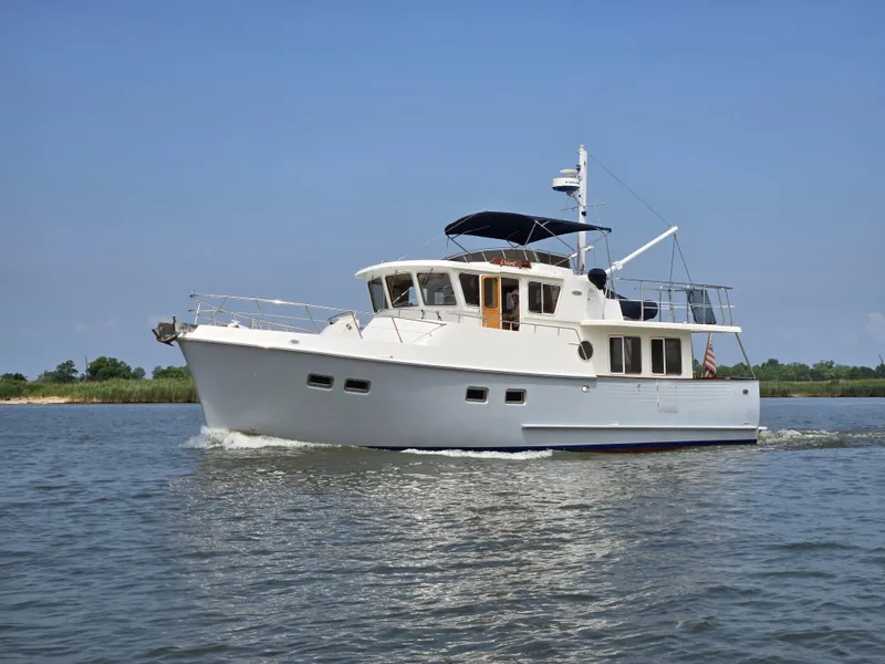 The Image of 1999 Selene 43 yacht cruising on calm waters under a clear blue sky. - 0