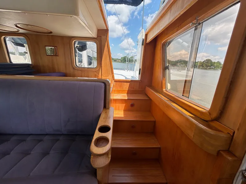 Slide: The Image of Interior of 1999 Selene 43 yacht with wooden stairs and seating. - 20