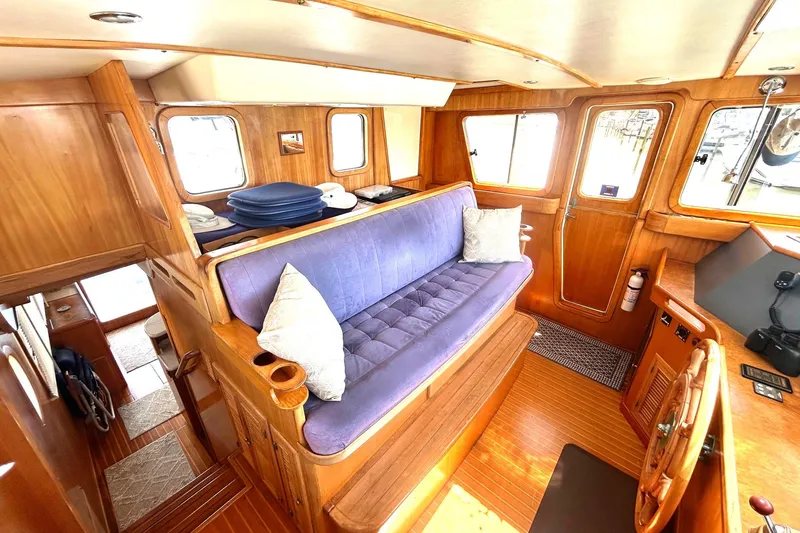 Slide: The Image of Cozy interior of 1999 Selene 43 yacht with wooden finish and blue seating. - 21