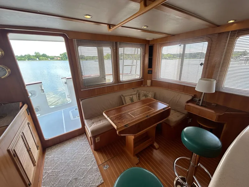 Slide: The Image of Cozy interior of 1999 Selene 43 yacht with wooden furnishings and waterfront view. - 24