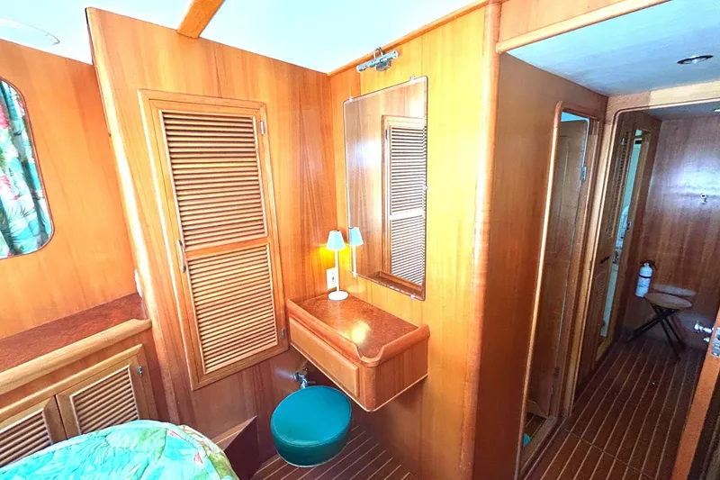 Slide: The Image of Cozy wooden interior of 1999 Selene 43 yacht with vanity and seating. - 30