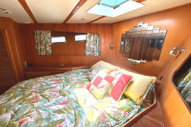 Slide: The Image of Cozy bedroom in 1999 Selene 43 yacht with floral bedding and wooden interior. - 31