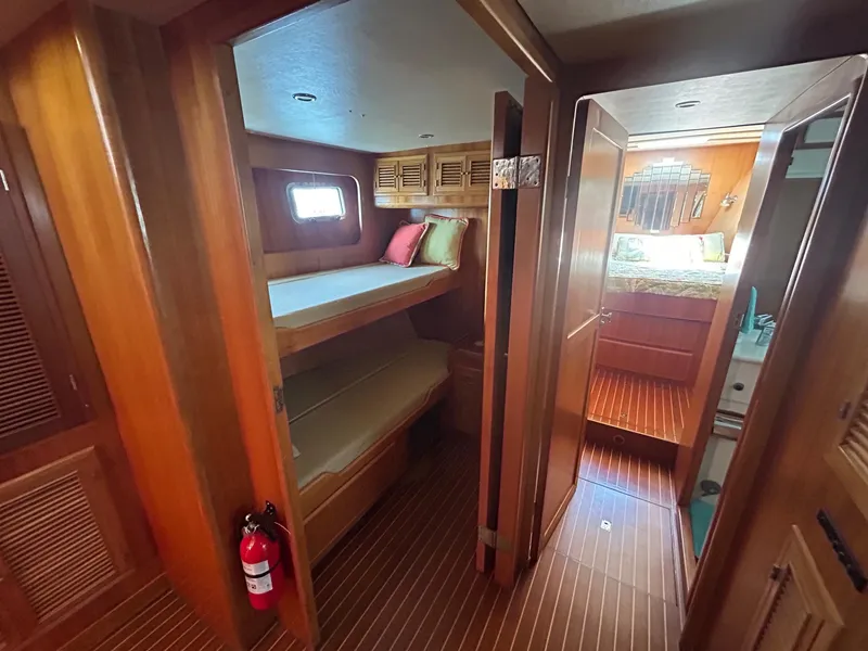 Slide: The Image of Interior of 1999 Selene 43 yacht with wooden bunk beds and bathroom. - 35