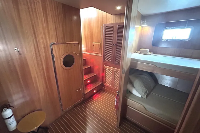 Slide: The Image of Cozy wooden interior of 1999 Selene 43 yacht with bunk beds and stairs. - 36