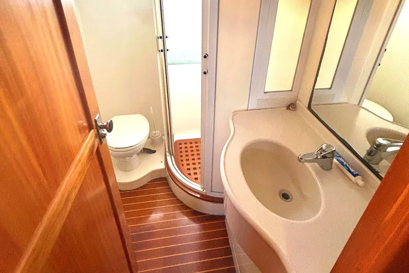 Slide: The Image of Bathroom interior of 1999 Selene 43 yacht with shower, sink, and toilet. - 37