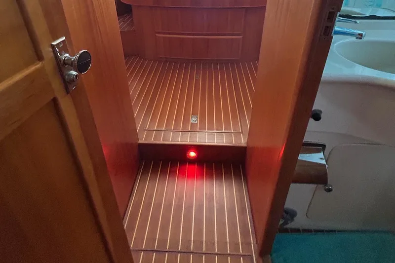 Slide: The Image of Wooden interior of 1999 Selene 43 yacht with red floor light. - 41