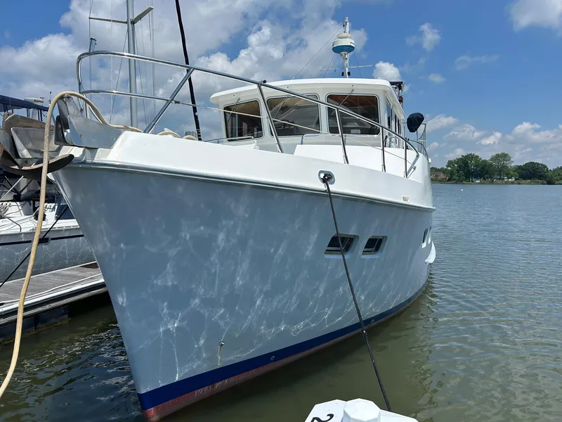 Slide: The Image of 1999 Selene 43 yacht docked on a sunny day with clear skies. - 8