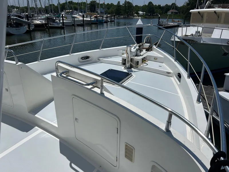 Slide: The Image of Selene 43 yacht deck, 1999 model, docked at marina with clear skies. - 9