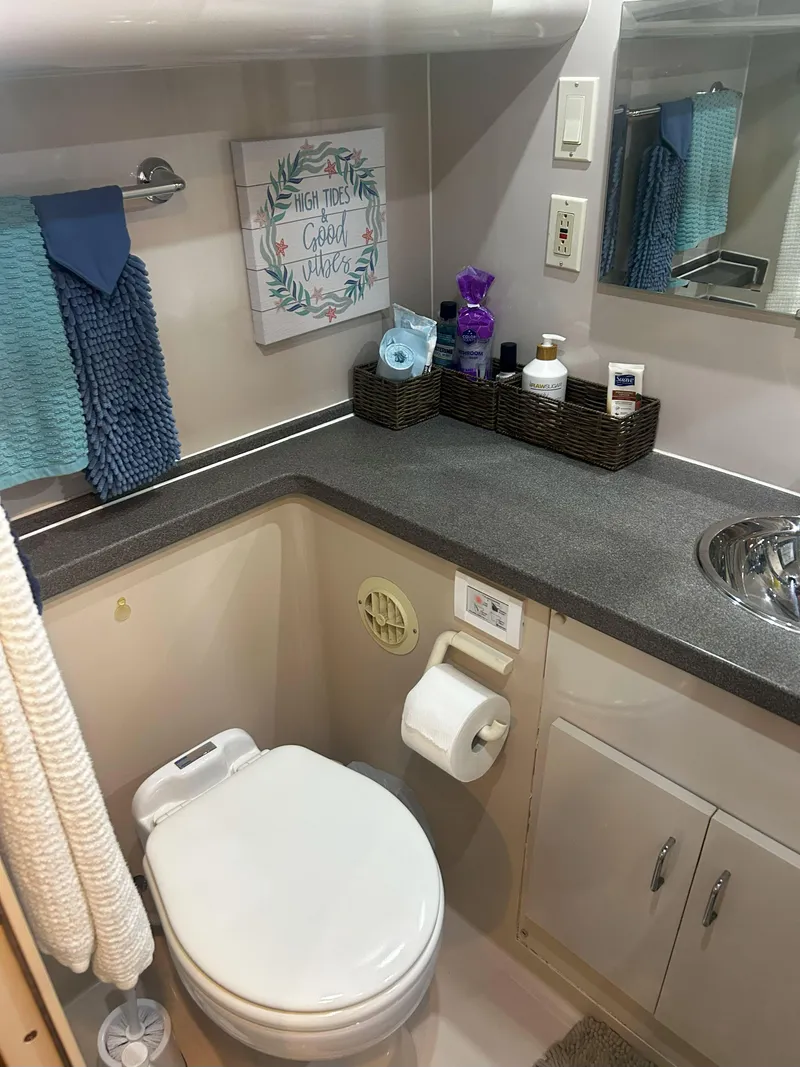 Slide: The Image of Bathroom of 1997 Mainship 34' M/Y with modern amenities and decor. - 19
