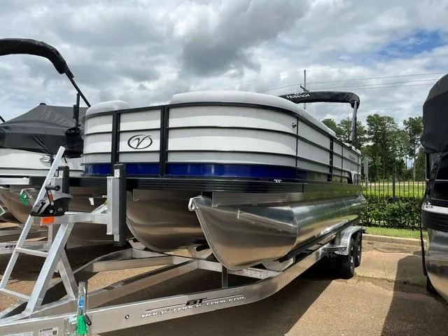 Slide: The Image of 2025 Veranda VS22RC pontoon boat on trailer under cloudy sky. - 4