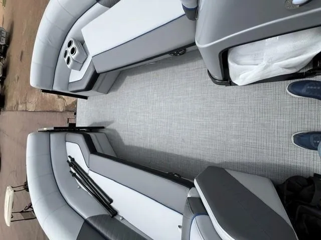 Slide: The Image of 2025 Veranda VS22RC boat interior with gray seating and cup holders. - 7