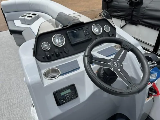 Slide: The Image of 2025 Veranda VS22RC boat dashboard with steering wheel and control panel. - 9