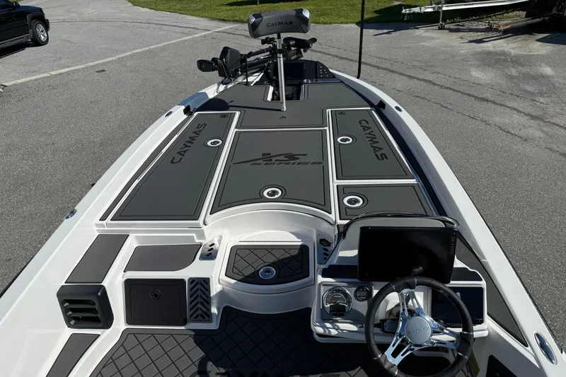 Slide: The Image of 2025 Caymas XS 21 boat deck with steering wheel and control panel. - 11