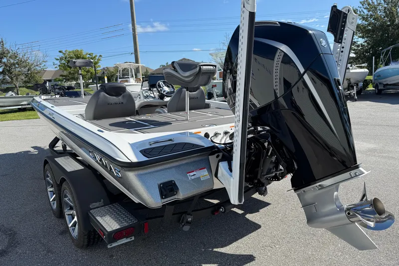 Slide: The Image of 2025 Caymas XS 21 boat with powerful outboard motor on a trailer. - 19