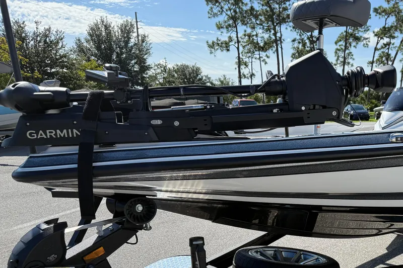 Slide: The Image of 2025 Caymas XS 21 boat with Garmin equipment, parked outdoors on a sunny day. - 4