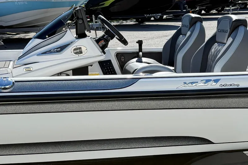 Slide: The Image of 2025 Caymas XS 21 boat interior with steering and seating details. - 5