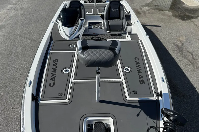 Slide: The Image of 2025 Caymas XS 21 boat with sleek seating and advanced Garmin technology. - 6