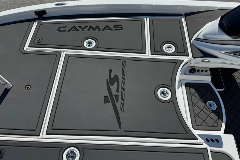 Slide: The Image of 2025 Caymas XS 21 boat deck with sleek design and storage compartments. - 8