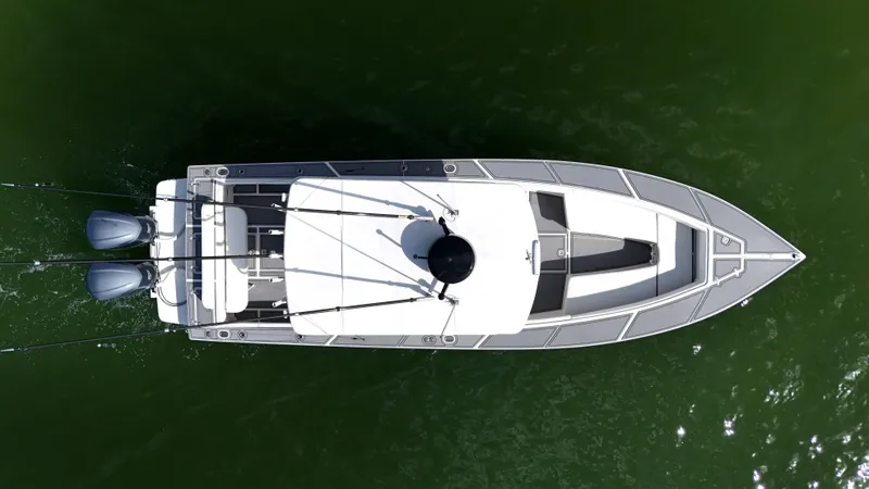 Slide: The Image of Aerial view of a 2004 Jupiter 31 FS boat on green water. - 11