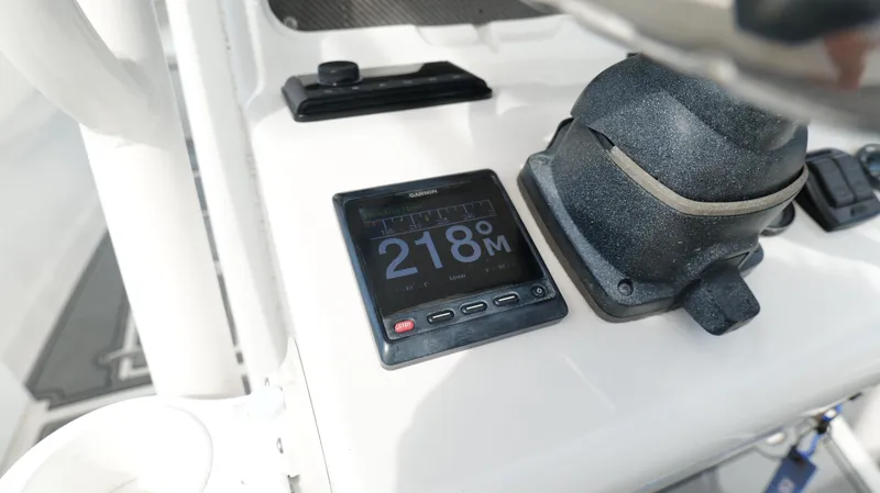 Slide: The Image of Close-up of a 2004 Jupiter 31 FS boat dashboard with navigation display. - 15