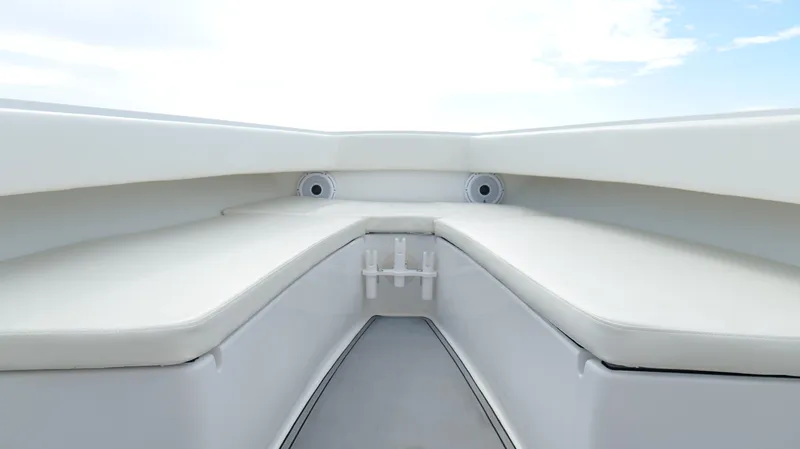 Slide: The Image of 2004 Jupiter 31 FS boat interior with white seating and clear sky. - 25