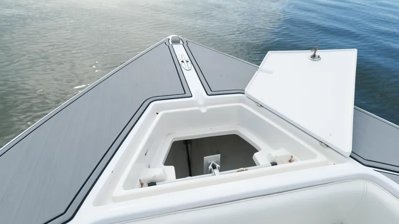 Slide: The Image of Bow of 2004 Jupiter 31 FS boat with open storage compartment. - 27
