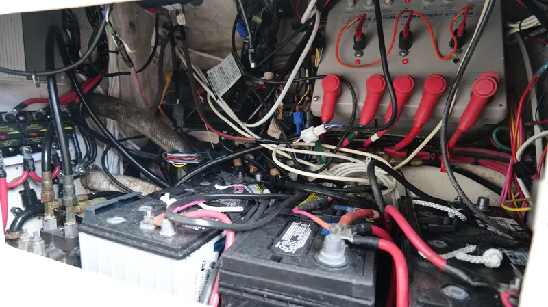 Slide: The Image of Electrical wiring and battery setup inside a 2004 Jupiter 31 FS boat. - 47