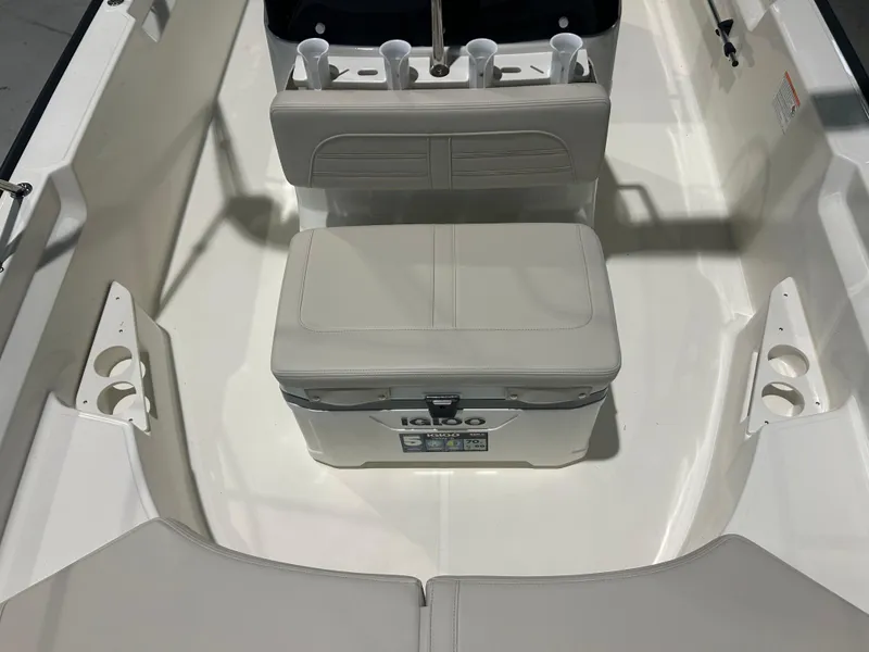 Slide: The Image of 2026 Boston Whaler 170 Montauk interior with seating and cooler. - 11