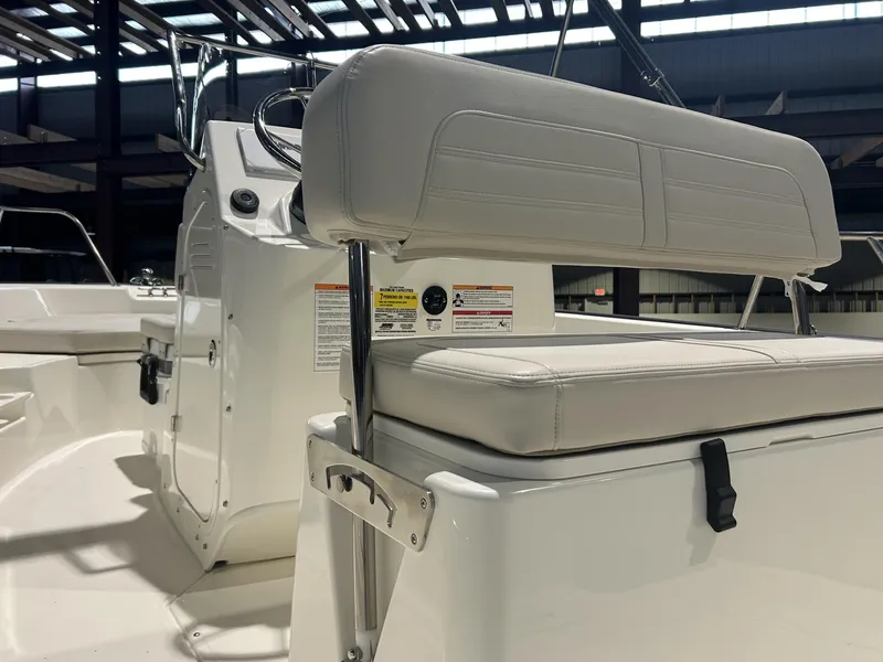 Slide: The Image of 2026 Boston Whaler 170 Montauk boat interior with white seating and console. - 15