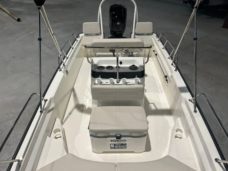 Slide: The Image of 2026 Boston Whaler 170 Montauk boat interior with seating and steering console. - 23