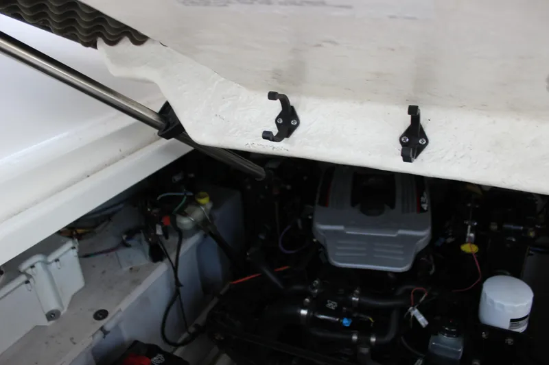 Slide: The Image of Engine compartment of a 2012 Bayliner 315 Cruiser boat, showing mechanical components. - 15