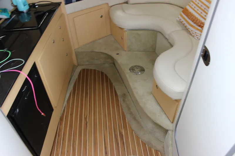 Slide: The Image of Interior of 2012 Bayliner 315 Cruiser with seating and kitchenette. - 21