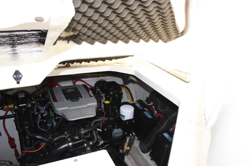 Slide: The Image of Engine compartment of a 2012 Bayliner 315 Cruiser with visible components and wiring. - 9