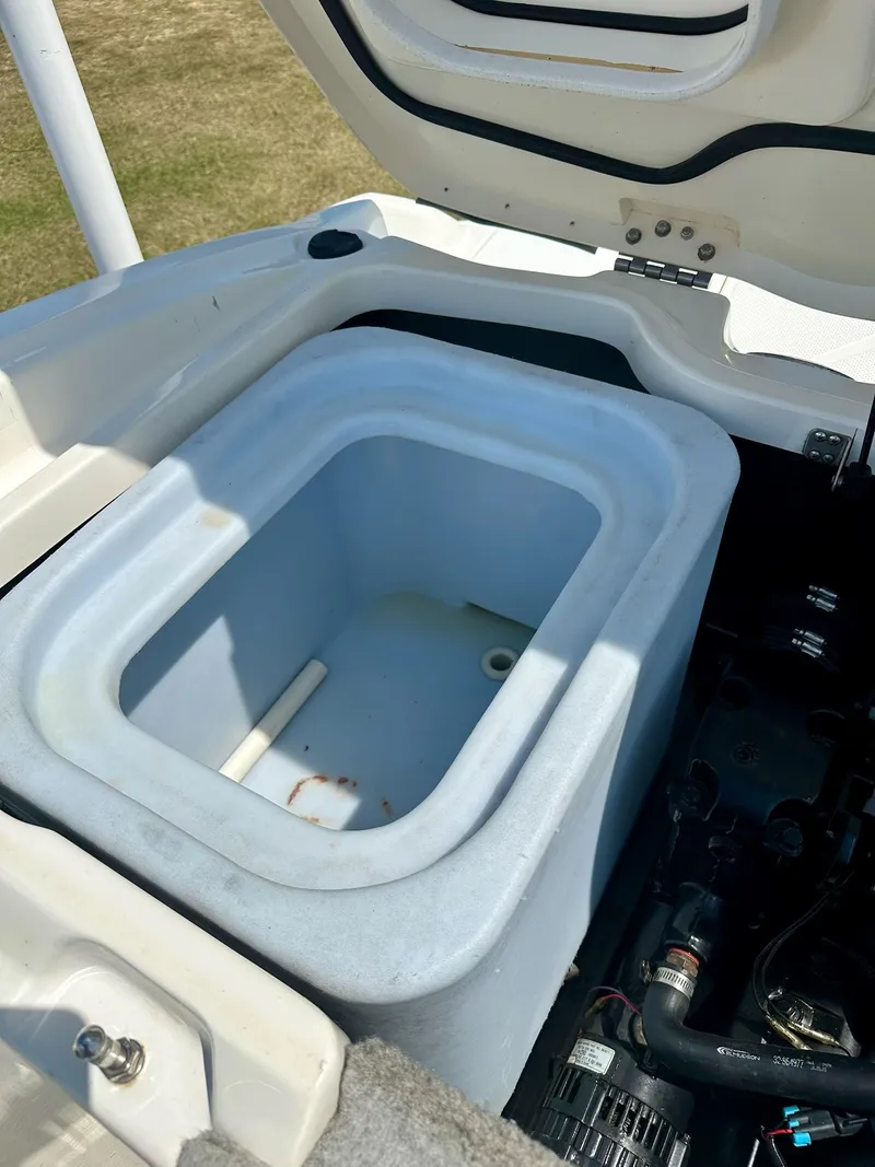 Slide: The Image of Open storage compartment in a 2011 Bayliner 184 SF boat. - 12