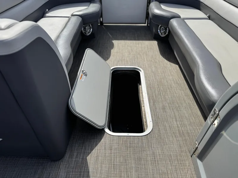 Slide: The Image of 2023 Godfrey Monaco 255 C interior with open storage compartment. - 13