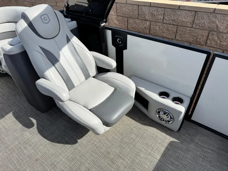 Slide: The Image of Luxurious seating on 2023 Godfrey Monaco 255 C boat with cup holders and speaker. - 15