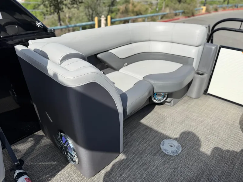 Slide: The Image of 2023 Godfrey Monaco 255 C boat interior with gray seating and modern design. - 20