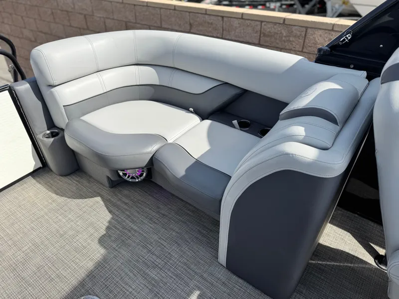 Slide: The Image of Luxurious seating on 2023 Godfrey Monaco 255 C pontoon boat, featuring sleek gray upholstery. - 21
