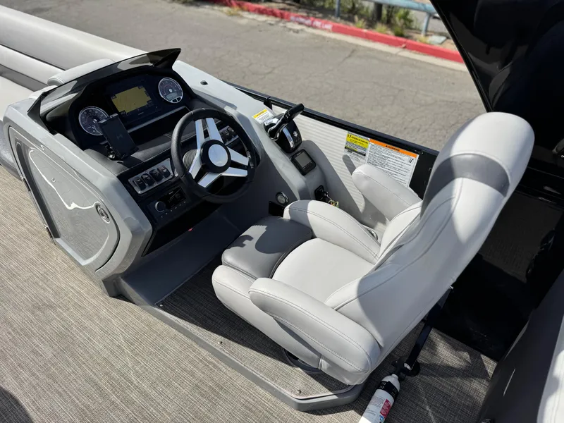 Slide: The Image of Captain's seat and dashboard of 2023 Godfrey Monaco 255 C boat. - 24